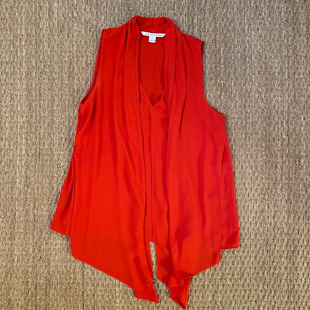Red draped sleeveless shirt